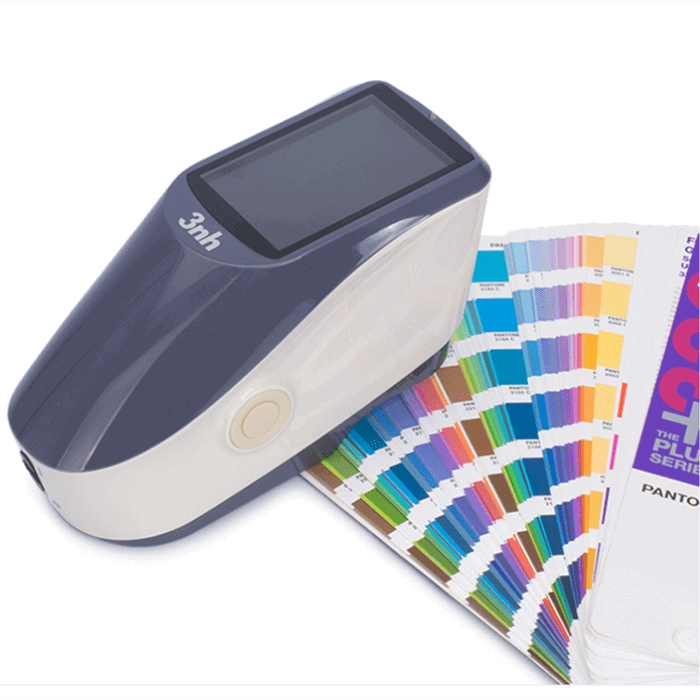 BagMakerPro quality control team comparing fabric color consistency with Pantone swatches in a professional light box