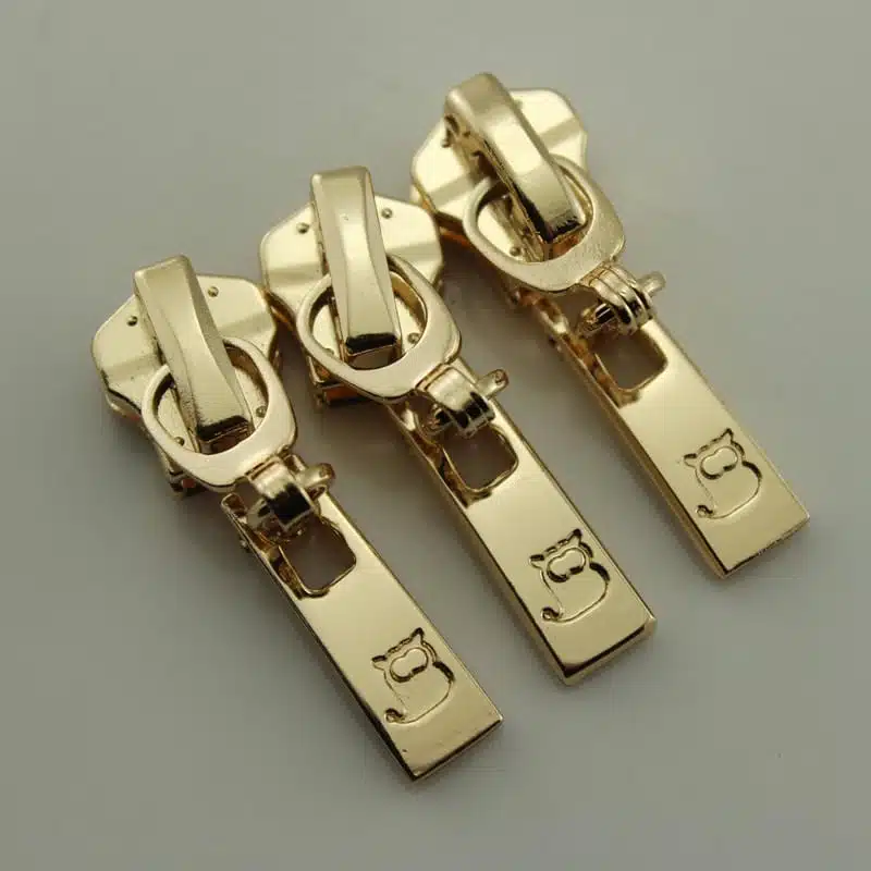 Custom branded zipper pullers with engraved logo