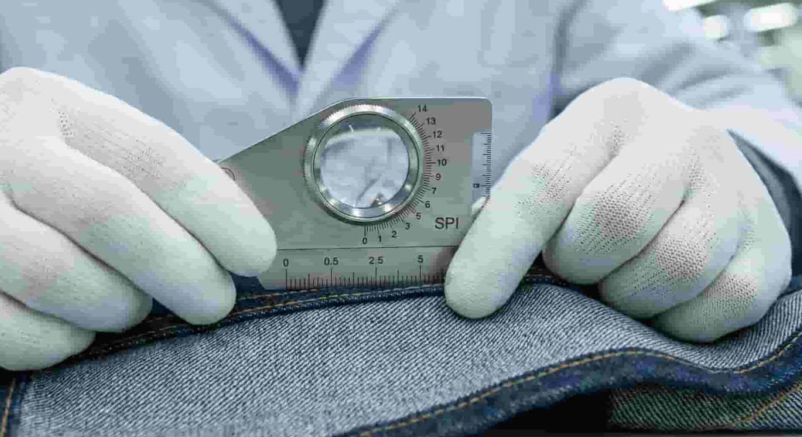  Technical inspection of stitching precision and SPI (stitches per inch) on a custom laptop backpack at BagMakerPro factory